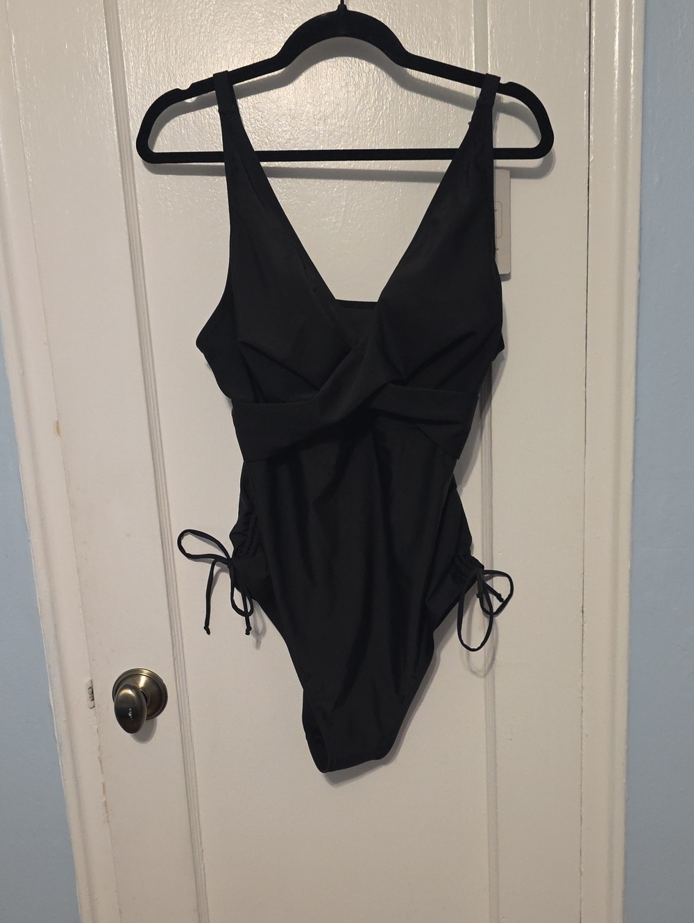 Sleek Black V-Neck One-Piece Swimsuit with Side Ties